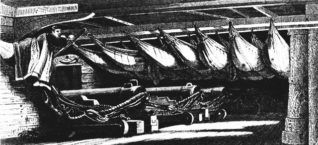 A starboard battery at night, with crewmen asleep in their hammocks