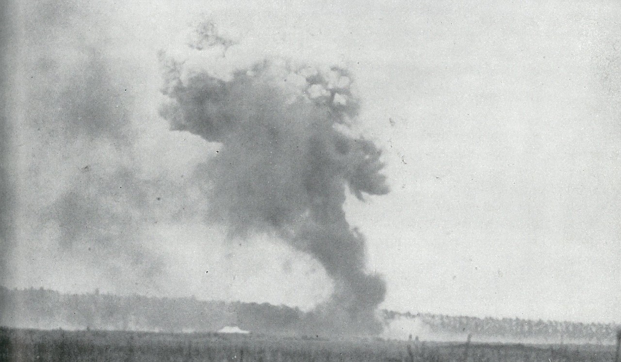 UNREMITTING JAPANESE AIR ATTACKS pounded Henderson Field on 24-25 October while U.S. aircraft were grounded by heavy rains which bogged down the airstrip. This shows a hit by a 500-pound bomb.