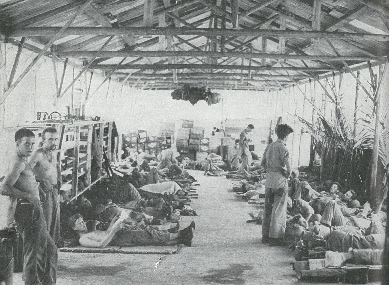 MALARIA BEGAN TO MAKE ITSELF FELT by October. Most of the Marines in this former Japanese sick bay are suffering from malaria, as great a casualty-producer in jungle war as enemy bullets.