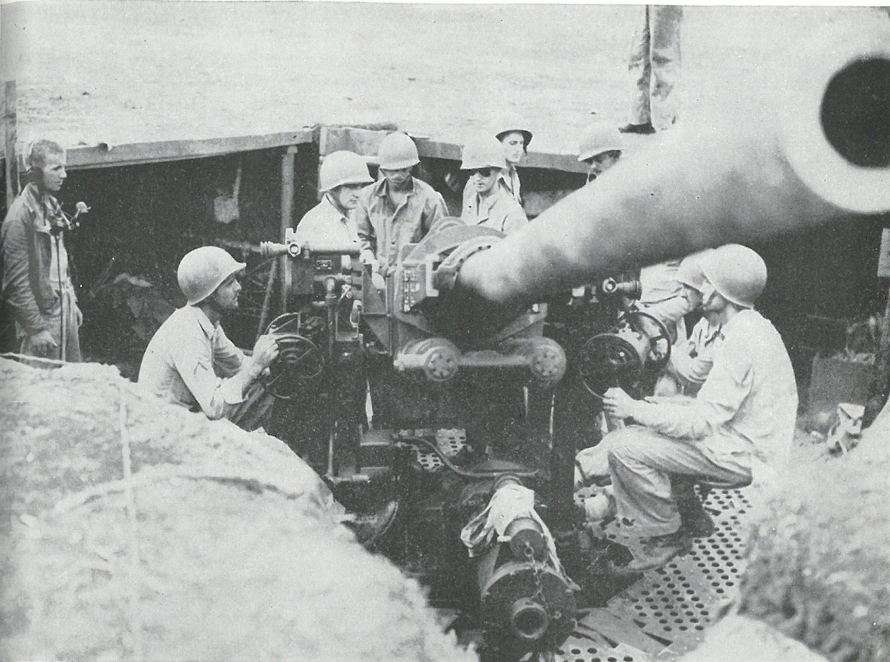 ANTIAIRCRAFT GUNNERS of the 3d Defense Battalion provided the sole air defense for Henderson Field during the critical hours while U.S. airplanes were grounded.