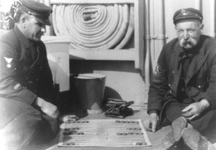 Image - Two Chief Petty Officers playing backgammon.