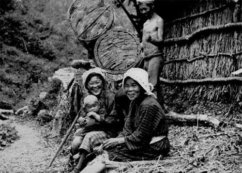 Wood Carriers Resting on a Steep Mountain Path