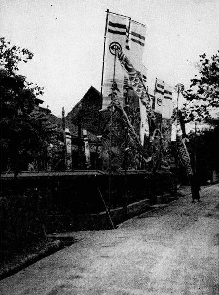 Boy Day (May 5) - Special banners and paper fish erected before a house where a son was born during the past year.