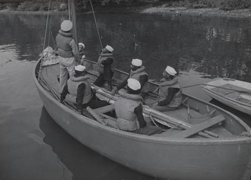 "'Learning sail' - Modern sailors of Uncle Sam's steam and diesel Navy still learn sailing tactics as part of their training. These Negro seamen, part of the 128 who recently arrived at historic Hampton Institute, Virginia, for training as Navy Petty Officers, are getting a few pointers from a Chief Boatswain's mate."