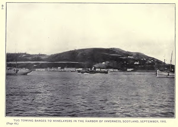 Tug towing barges to minelayers in the harbor of Inverness, Scotland, September, 1918.