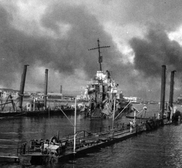 <p>80-G-32769: Japanese Attack on Pearl Harbor, December 7, 1941. USS Shaw (DD 373) in floating drydock after the attack.</p>
