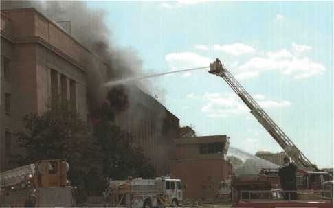 District of Columbia Fire Department Tower 10 fighting fire in upper stories.