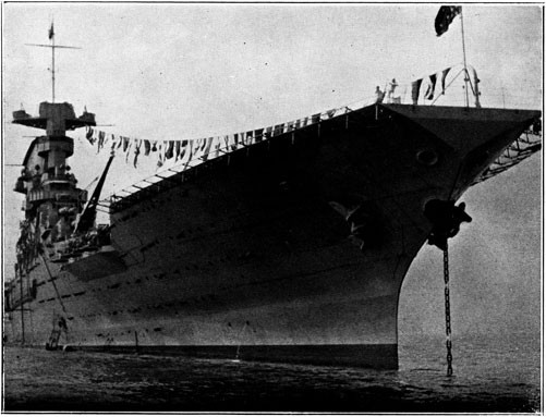 Image of USS Lexington with flags strung.