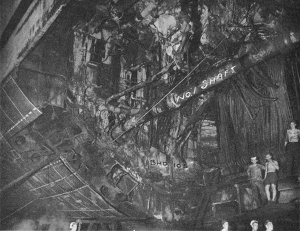 Photo 28: CANBERRA (CA 70) Looking aft at torpedo hole after removal of damaged structure.