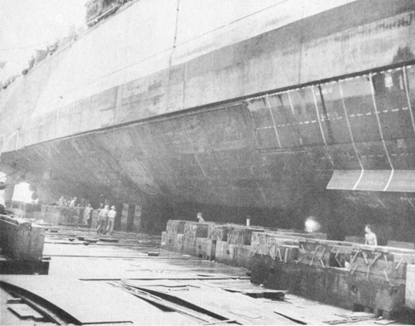 Photo 31: CANBERRA (CA 70) Looking aft at completed repairs to underwater body.