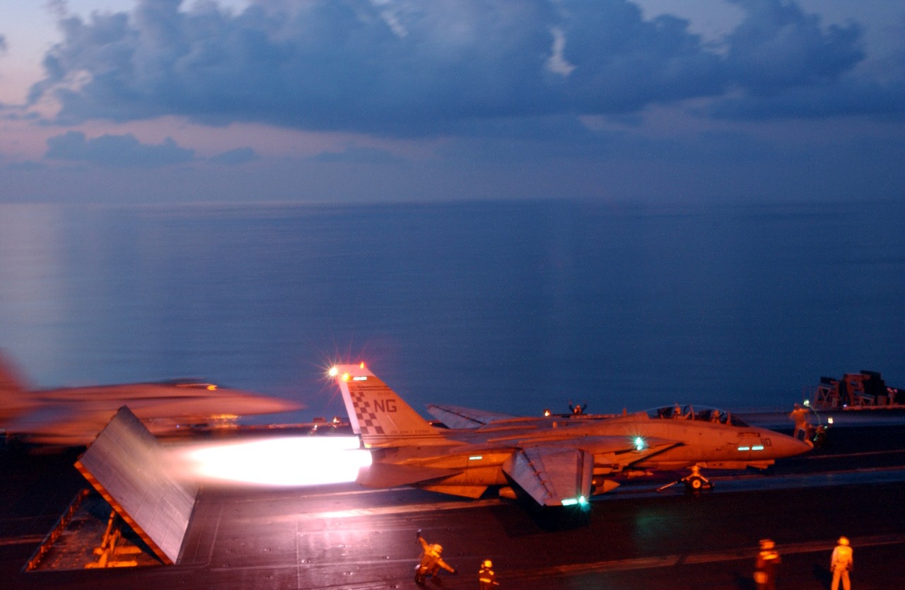 jpeg of an F-14 Tomcat from Fighter Squadron 211 (VF-211) launching from the flight deck of John c. Stennis (CVN-74) to conduct missions in support of Operation Enduring Freedom