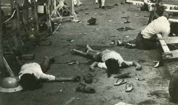 Image - Today Communist terrorism is taking its toll of South Viet-Nam's innocent people. The bodies of 2 boys and a man lie in the street following a Viet Cong grenade attack that killed 7 persons and wounded 47. The grenade was tossed into a helicopter on display at Saigon City Hall on Republic Day, Oct. 26, 1962.