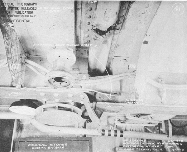 Photo 23: Interior view of midship deck house showing damage to expansion joint frame 108.