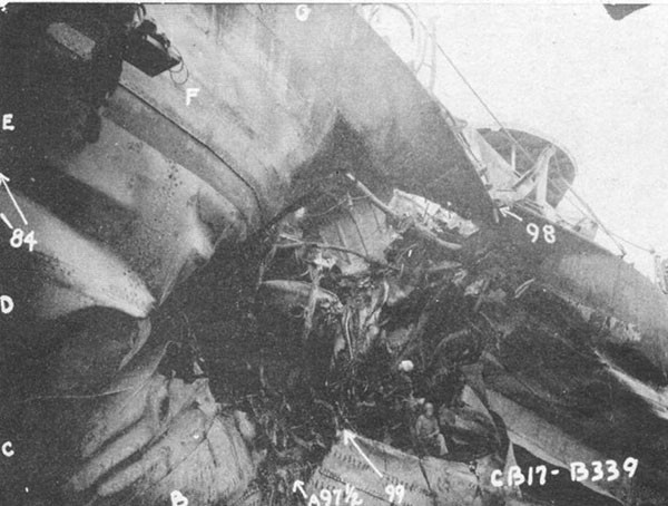 Photo 4: General view of torpedo damage looking aft. Sheer strake at frame 98 broke while docking.