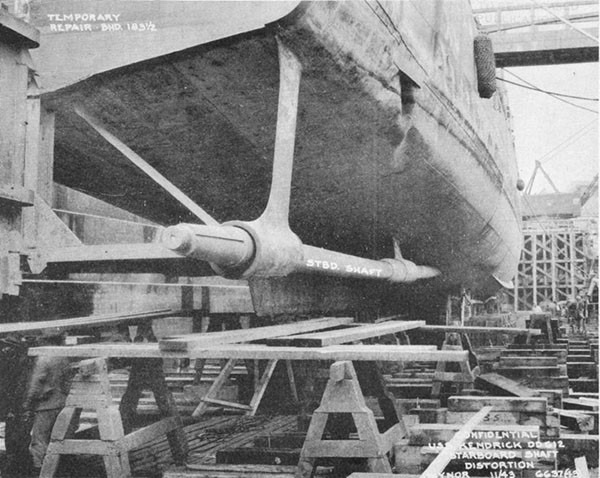 Photo 47: Starboard view of stern showing details of temporary rudder connections to hull.