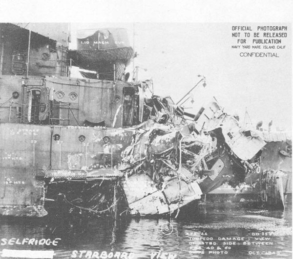 Photo 50: Starboard side view of torpedo damage to SELFRIDGE.