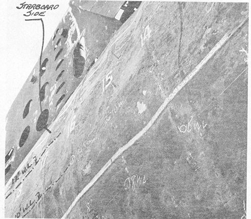 Photo 6-2: TUNNY (SS282). Close view, looking up, showing depressions in pressure hull plating between frames, starboard side.