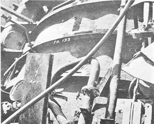 Photo 7-2: SALMON (SS182). General view, looking aft, showing deformation in pressure hull plating between tank tops over the after engine room, frames 129-137.