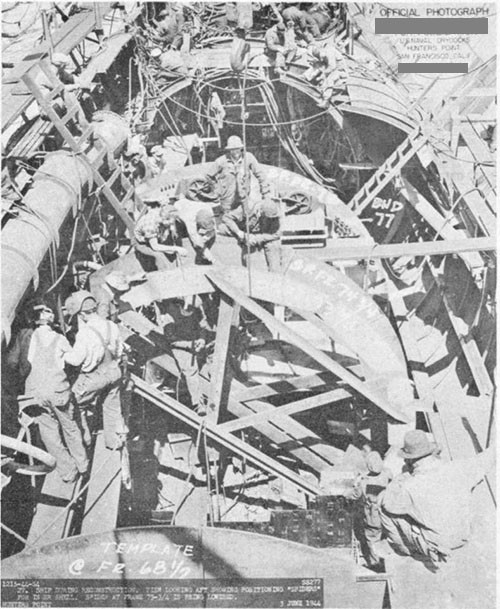 Photos 9-14 and 9-15: SCAMP (SS277). Two views showing reconstruction of damaged portion of ship at U. S. Naval Drydocks, Hunter's Point. Note positioning "spiders" for pressure hull shell plating.
