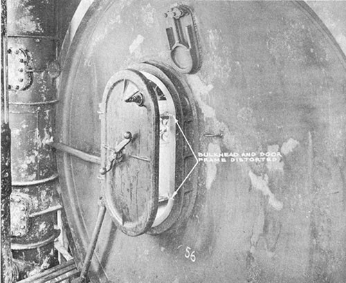 Photo 5-5: KINGFISH (SS234). View showing conning tower after bulkhead, indicating points at which W.T. door dogs bound due to distortion of bulkhead and door seat.