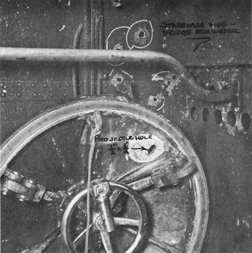 Photo 13-5: GROWLER (SS215). View of conning tower upper hatch, showing 13mm projectile hole (1/2" x 3/4").
