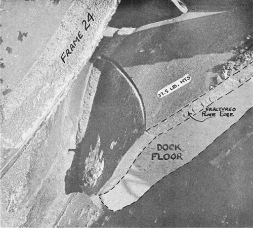 Photo 14-5: DRAGONET (SS293). View taken from interior of forward torpedo room looking down and to port, showing close detail of typical fracture in pressure hull plating (37.5 pound HTS) at damage "C".