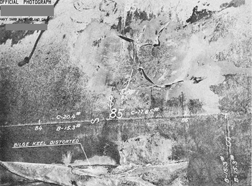 Photo 14-8: DRAGONET (SS293). View of damage "E" showing rupture and deformation of outer shell plating of MBT Nos. 6B and 6D at wing bulkhead 85 dividing the two tanks.