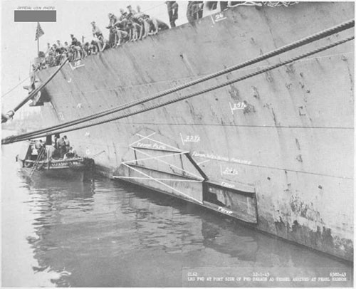 Photo 14: Torpedo damage, port side, showing temporary patch.