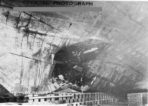 Photo 2: Torpedo damage to starboard shell, looking forward. Note crease caused by first platform. (U.S.S. CAPELLA).