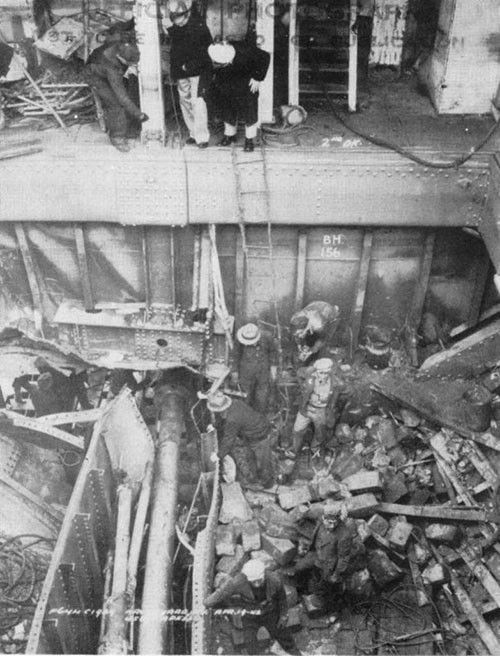 Photo 8: Damage in No. 5 cargo space after shaft alley top has been removed. Note good condition of shaft. (U.S.S. CAPELLA).