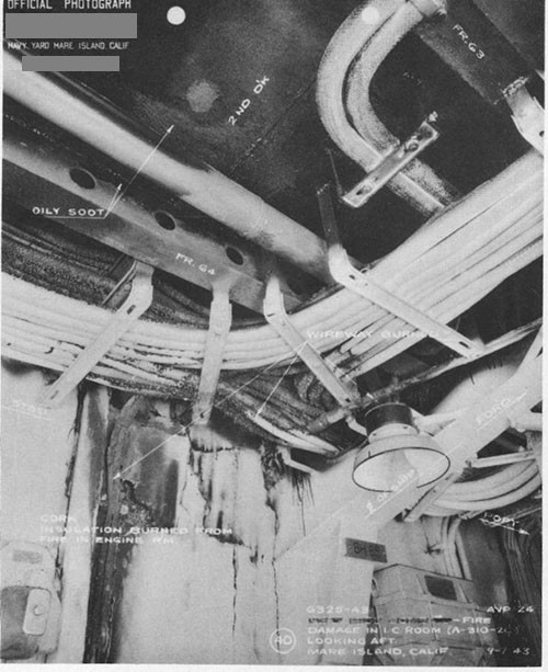 Photo 17: Fire damage in I.C. room (A-310-2C) looking aft.