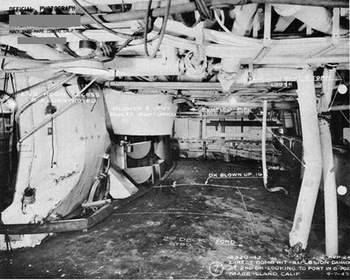 Photo 10: Looking to port in B-202L, showing bulging of second deck and damage to access and ventilation trunks due to blast.