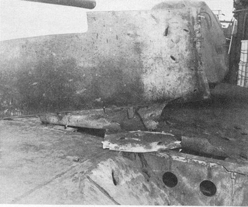 Photo E-14: Second hit. Damage to STS shield between Nos. 5 and 7 guns.