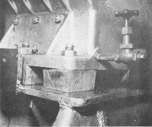 Photo I-6: First near-miss. Showing compression failures in chocks, port side No. 1 steady bearing, No. 3 shaft.