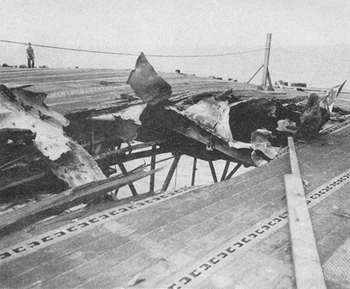 Photo J-3: Hole in flight deck at frame 42, made by crashing suicide plane.