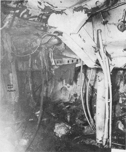 Photo J-4: View of destruction in A-305-A where bomb carried by suicide plane detonated.