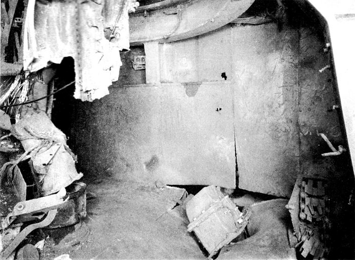 Photo 41. 19 March Action. Upper handling room No. 7 5-inch twin mount. Looking aft port side. Note damage to after port hoist.