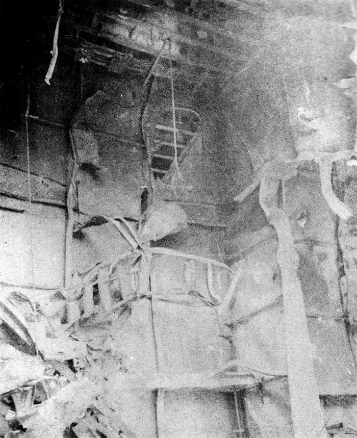 Photo 34: 19 March Action. View of demolished ladder in hangar.