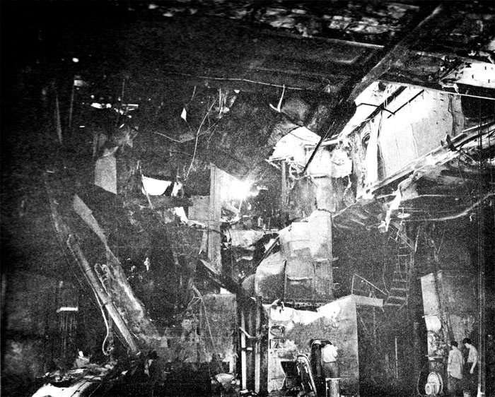 Photo 5: 30 October Action. View taken from hangar looking to starboard. Note damage to air intake ducts; bomb elevator trunk; ladder.