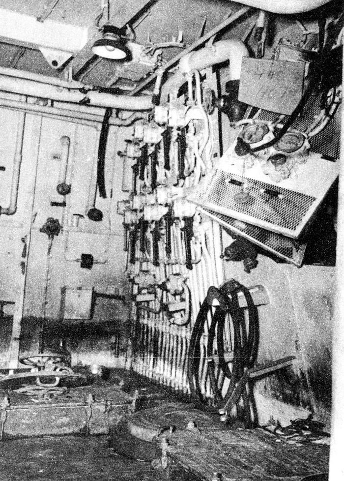 Photo 7: 30 October Action. View showing distortion of uptake enclosure bulkhead on which hydraulic valve controls are mounted, frame 112, compartment B-313-E. Hydraulic controls remained operable.