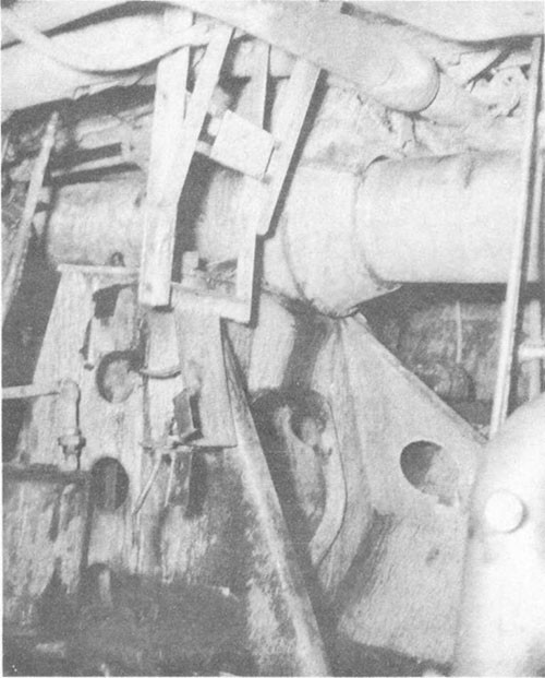 Photo No. 11: Spring bearing for No. 1 shaft in after fireroom. The distortion of starboard shell plating in vicinity of frame 83 forced the bearing and shaft upward.