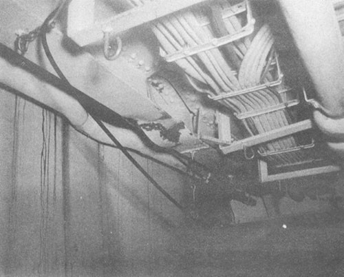 Photo No. 12: Buckling of No. 3 port longitudinal, under main deck, in compartment B-203-2L.