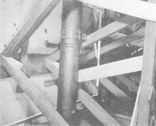 Photo No. 15: Shoring in C-313-L on forward side of bulkhead 136. Note the use of side cleaning planks and fueling booms.