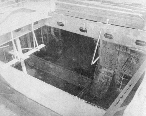 Photo No. 20: Temporary transverse and longitudinal bulkheads installed in the hangar space by the ship's force at Ulithi.
