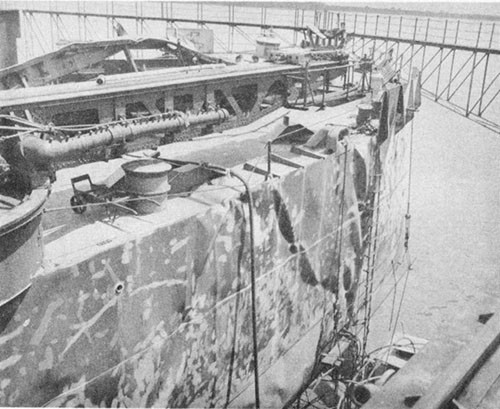 Photo No. 21: Wrinkling of port main deck and shell plating at the stern.