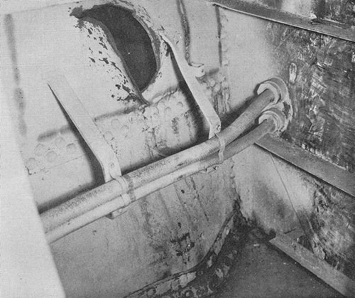 Photo 15: USS NEW ORLEANS - Hole in port shell at frame 136, caused by bow striking port quarter as it drifted aft.