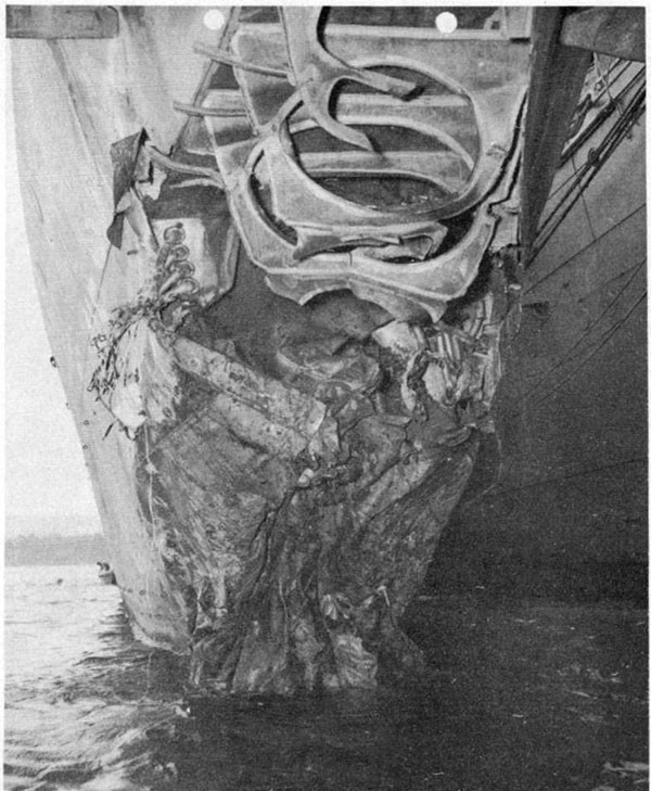 Photo 3: Damage to bow resulting from torpedo hit. Alongside U.S.S. CURTISS, 17 September, 1942.