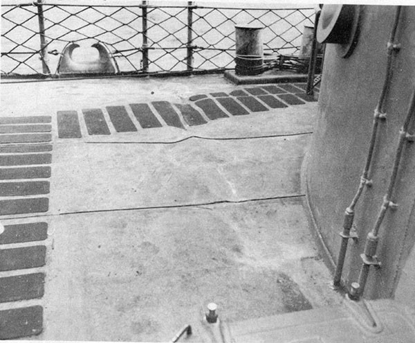 Photo 5: Wrinkles, starboard side, forecastle deck frame 37 caused by flexural vibration of the vessel as a result of the shock of the torpedo detonation.