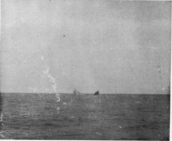 Photo 7: At 0750, 19 October, 1942. Heavy list to starboard. Breaking up process well advanced.