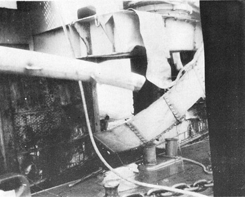 Hole blown in hangar deck at about frame 114. Gun sponson was damaged by ships alongside.